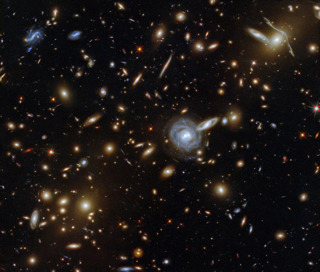 This packed ESA/Hubble Picture of the Week showcases the galaxy cluster ACO S 295, as well as a jostling crowd of background galaxies and foreground stars. Credit: NASA. Also, see "The Hubble Deep Field: The Most Important Image Ever Taken" on YouTube.